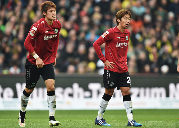 HANOVER, GERMANY - MARCH 21: Hiroki Sakai and Hiroshi Kiyotake of Hannover look dejected during the Bundesliga match between Hannover 96 and Borussia Dortmund at HDI-Arena on March 21, 2015 in Hanover, Germany. (Photo by Stuart Franklin/DFL via Getty Images)