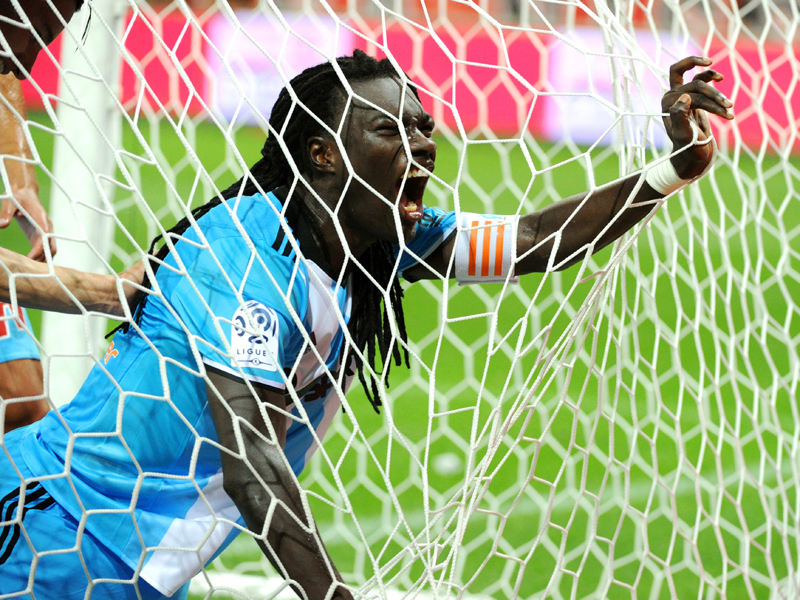 逆転のPKを決めて雄叫びを上げるゴミス　[写真]＝Icon Sport via Getty Images