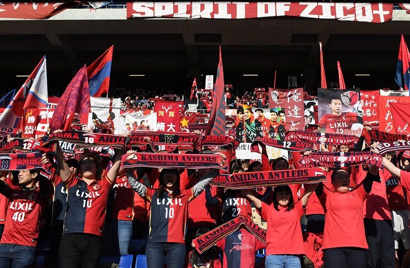 SUITA, JAPAN - JANUARY 01:  (EDITORIAL USE ONLY) Supporters of Kashima Antlers hold mufflers prior to the 96th Emperor's Cup final match between Kashima Antlers and Kawasaki Frontale at Suita City Football Stadium on January 1, 2017 in Suita, Osaka, Japan.  (Photo by Masashi Hara/Getty Images)