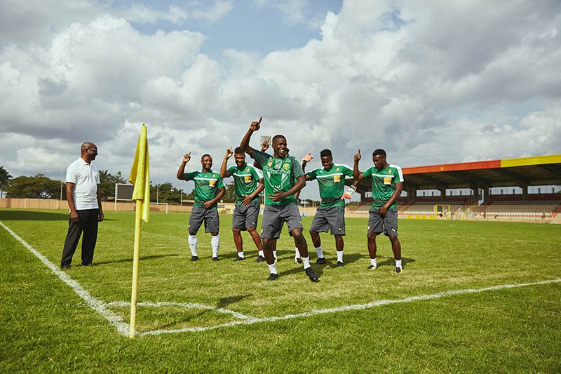 KEY VISUAL MHD and Cameroon squad and Roger Milla