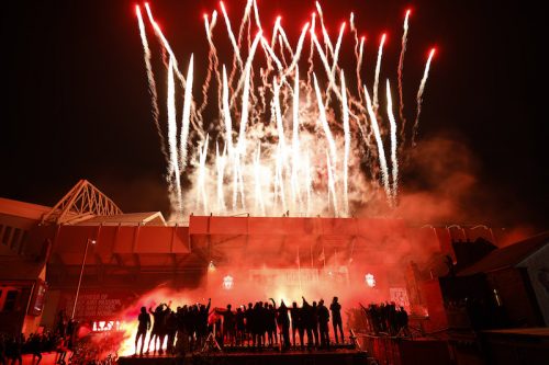 Fans Celebrate As Liverpool FC Lift The Premiership Trophy At Anfield