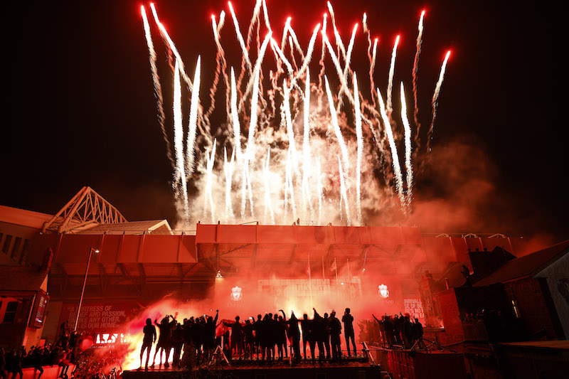 Fans Celebrate As Liverpool FC Lift The Premiership Trophy At Anfield