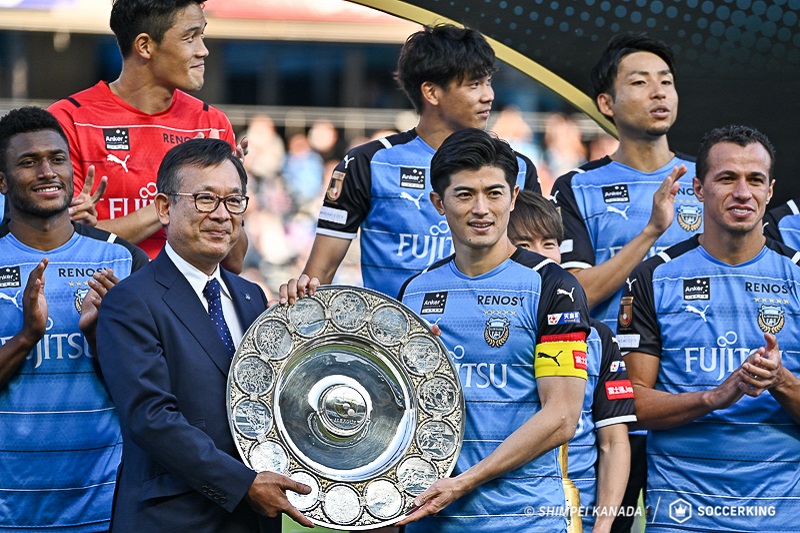 村井満