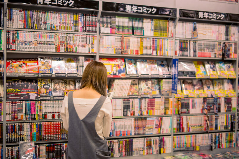 Osaka,,Japan,-,May,27,,2017:,Young,Girl,Reading,Manga